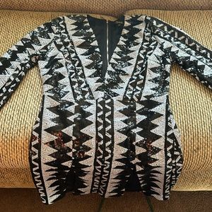 Worn once for New Years. Black/White 2 split dress. Sparkled down front & back.